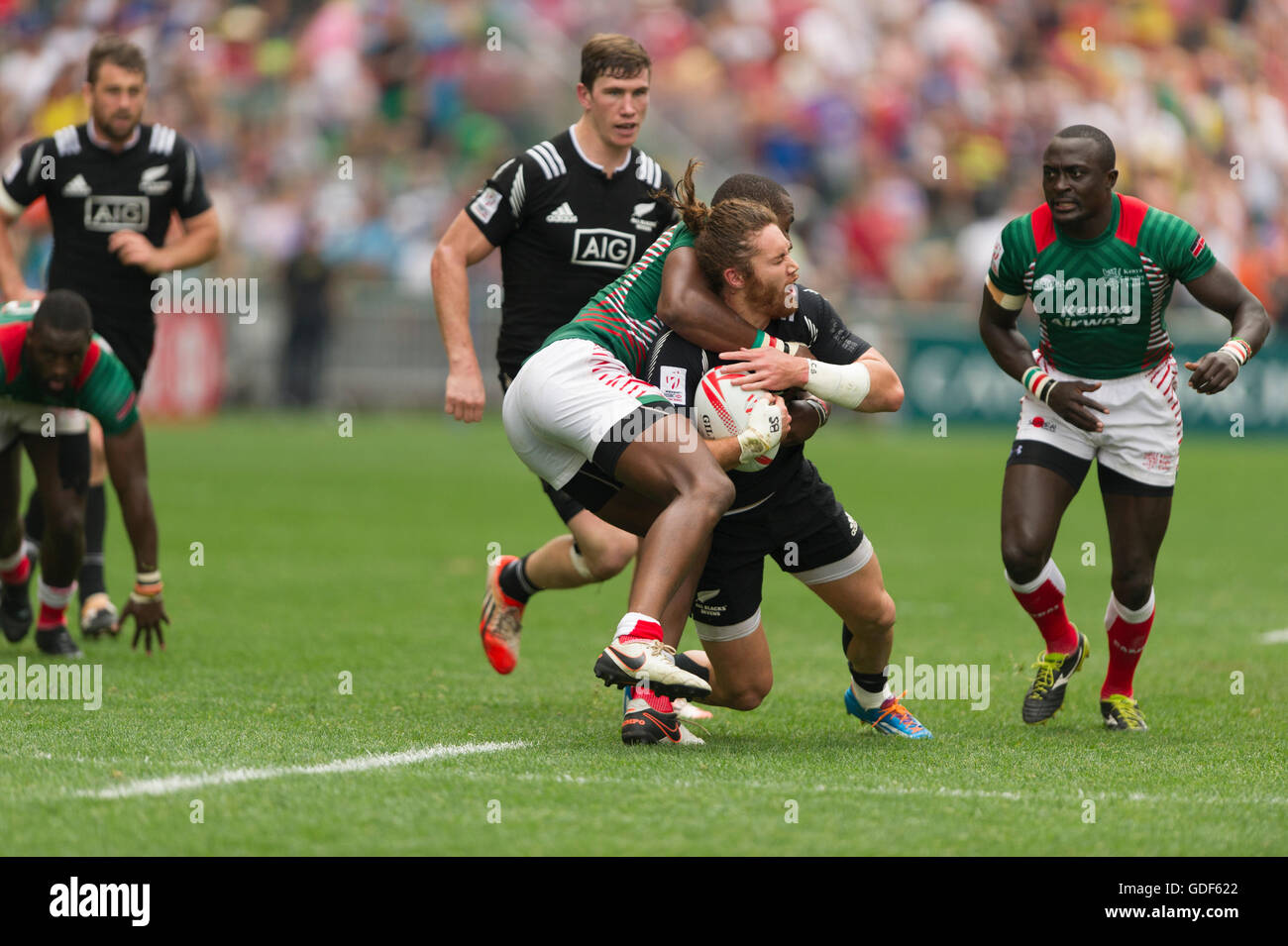 Rugby Sevens action, Collins Injera of Kenya, tackles Gillies Kaka of New Zealand, Hong Kong Stadium, China. Stock Photo
