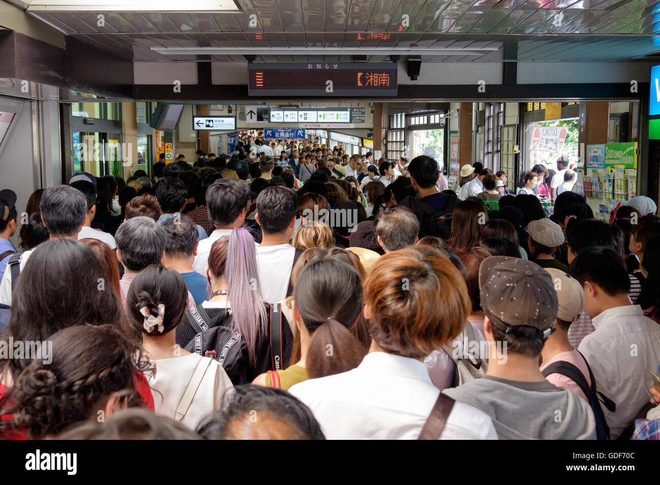 Crowds of people at a the Harajuku station on the Tokyo metro railway, Japan. Stock Photo