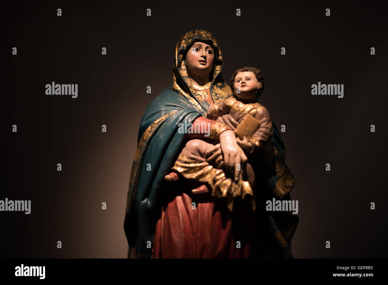 LISBON, Portugal - A 17th century guilded wooden statue of Madonna del Popolo. The Museu de São Roque is a museum attached to the the Igreja de Sao Roque to display various historical religious artefacts from the church. The 16th century Igreja de São Roque was one of the earliest Jesuit churches in Christendom and features a series of ornately decorated Baroque chapels. Stock Photo