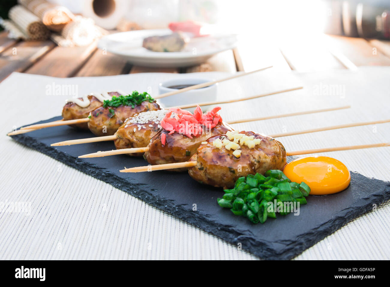 Tsukune Japanese chicken yakitori meatballs served with chili sauce