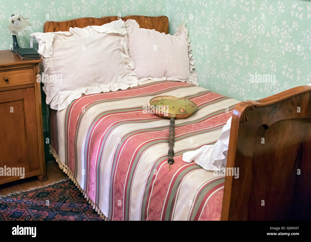 old bed with bed heaters Stock Photo Alamy