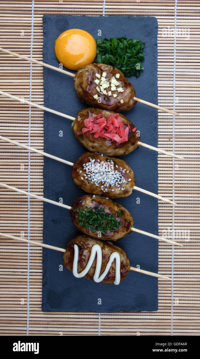 Tsukune Japanese chicken yakitori meatballs served with chili sauce