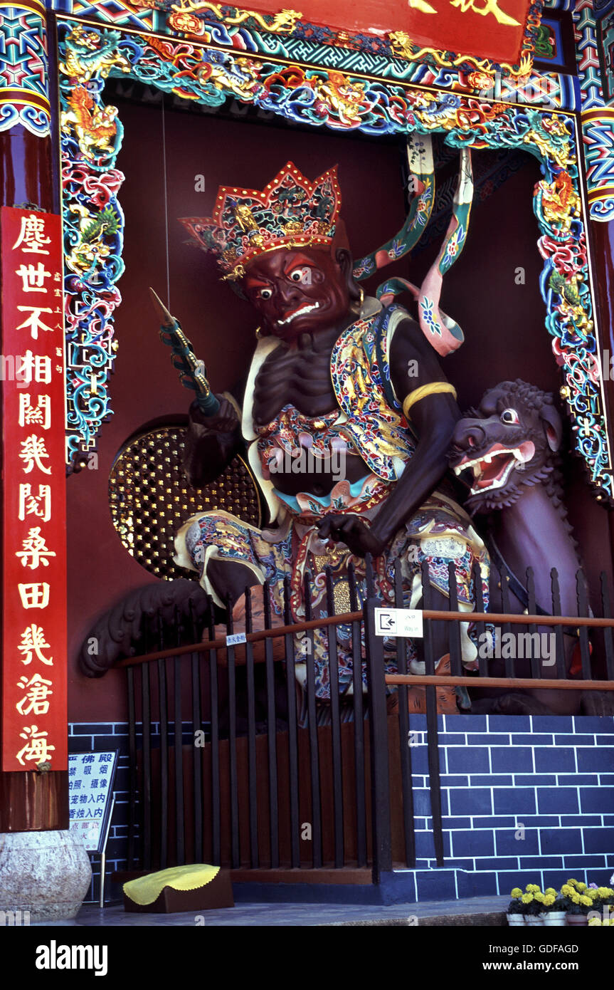 A ferocious god at the entrance to the Huatang Temple near Kunming in China. Stock Photo