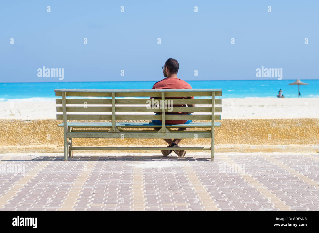 Lonely Man Sitting On A Chair At The Sea Stock Photo Alamy