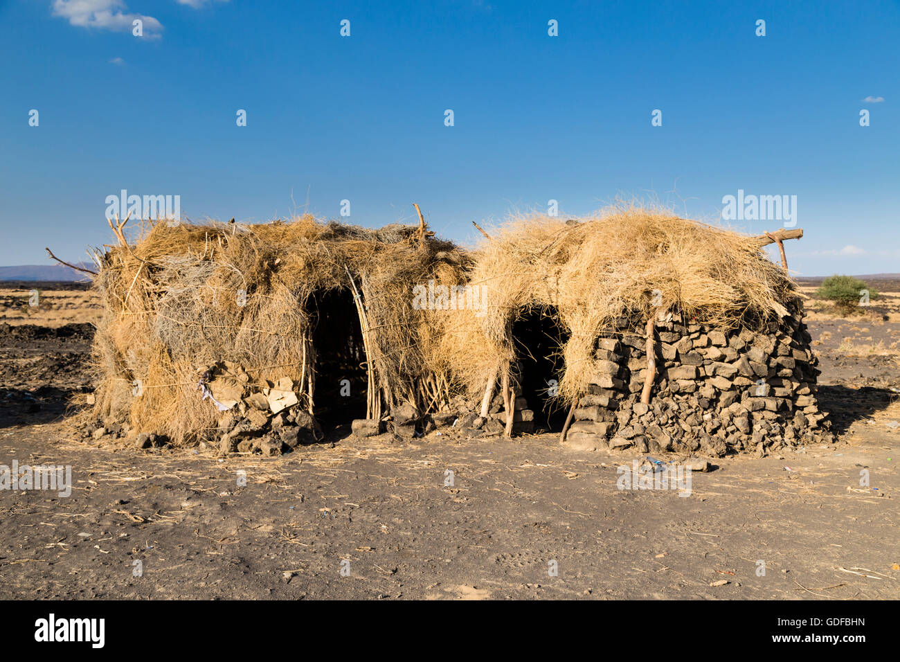 Huts in the Afar settlement at the foot of the active volcano Erta Ale, Danakil Depression, Afar Triangle, Ethiopia Stock Photo