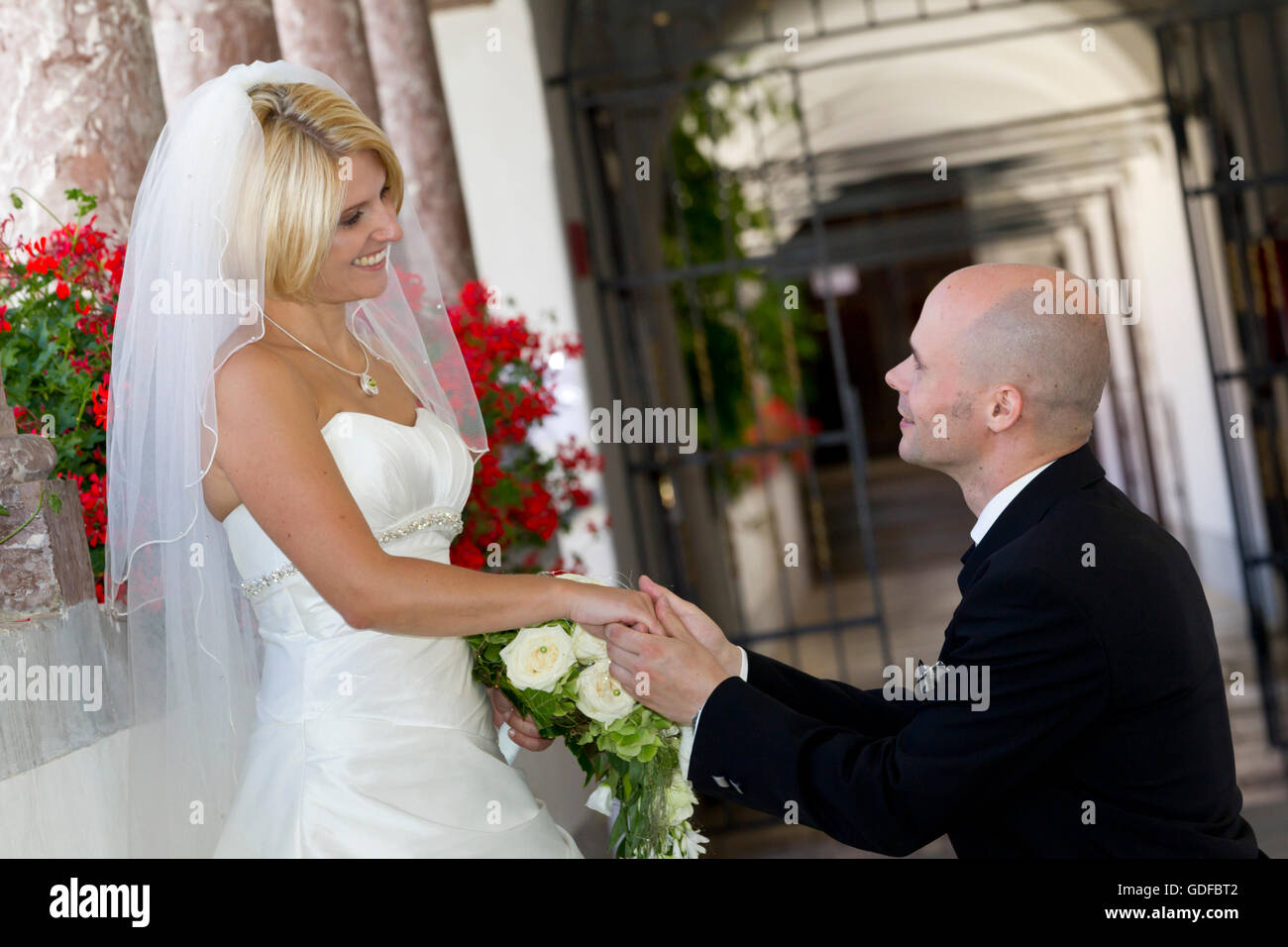 Bridal couple, bridegroom asking for her hand in marriage Stock Photo