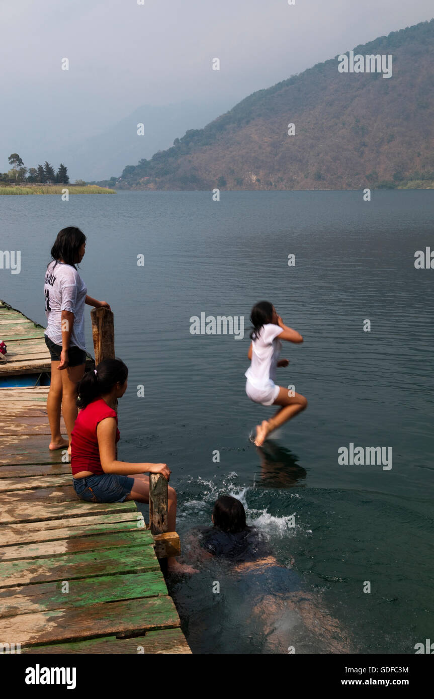Children, swimming, jumping into Lago de Atitlan lake, San Lucas Toliman, Guatemala, Central
