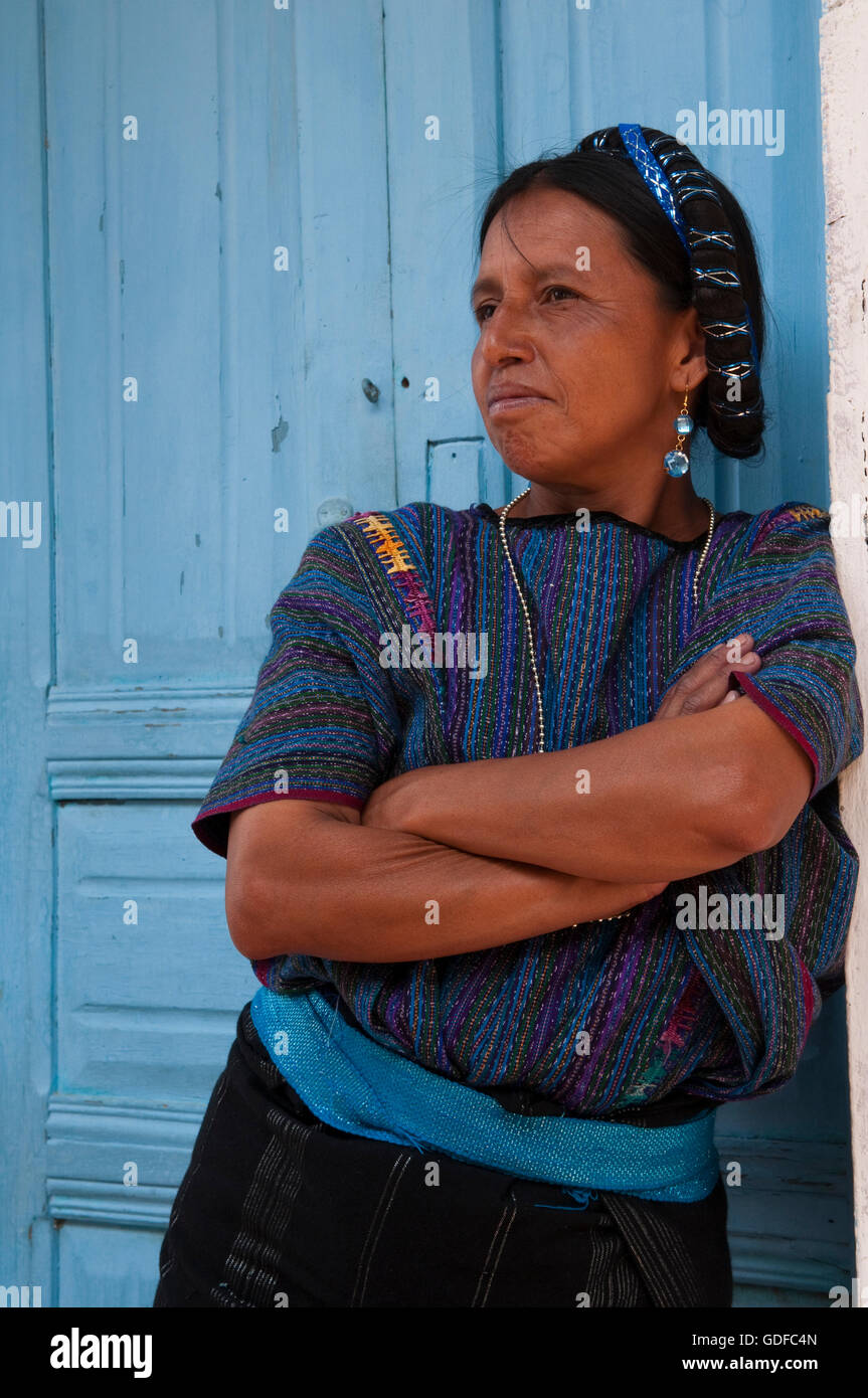 Woman leaning against door frame, San Antonio Palopo, Lago de Atitlan