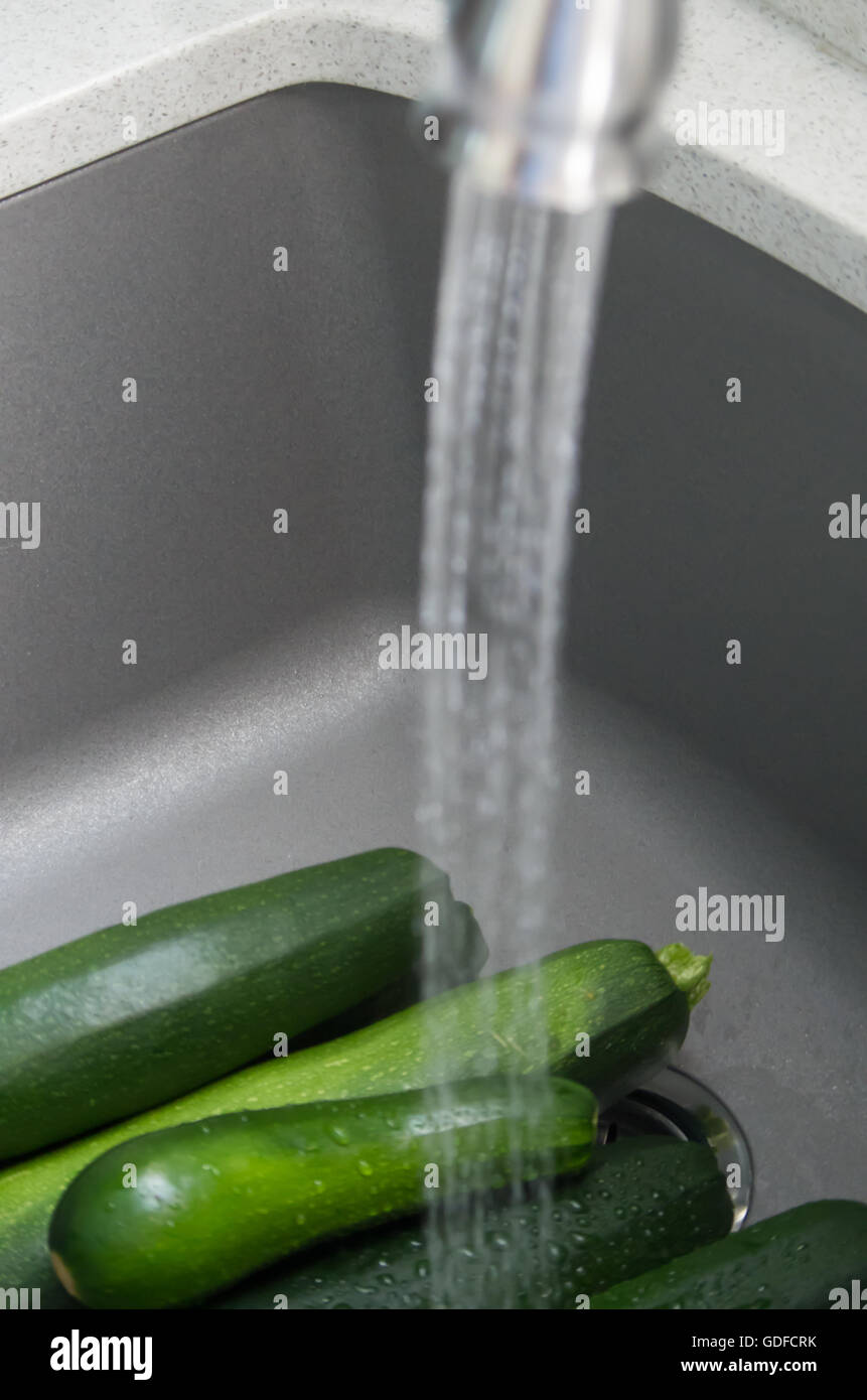 Washing Zucchini from the Garden Stock Photo Alamy