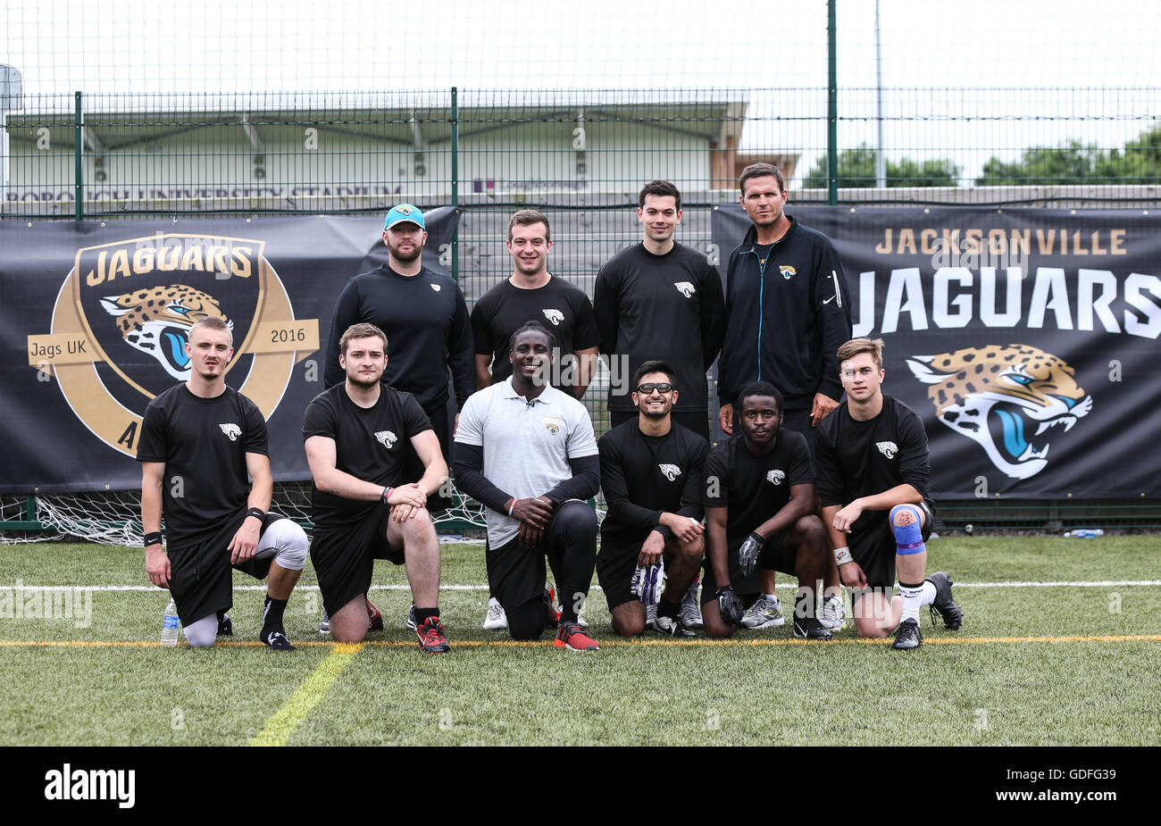 Jacksonville Jaguars assistant defensive line coach Aaron Whitecotton (back row, left), Denard Robinson (front row, centre left) and Tony Boselli (back row, right) pose for a photo with students during the Jacksonville Jaguars academy day at Loughborough University. PRESS ASSOCIATION Photo. Picture date: Friday July 15, 2016. Photo credit should read: Barry Coombs/PA Wire Stock Photo