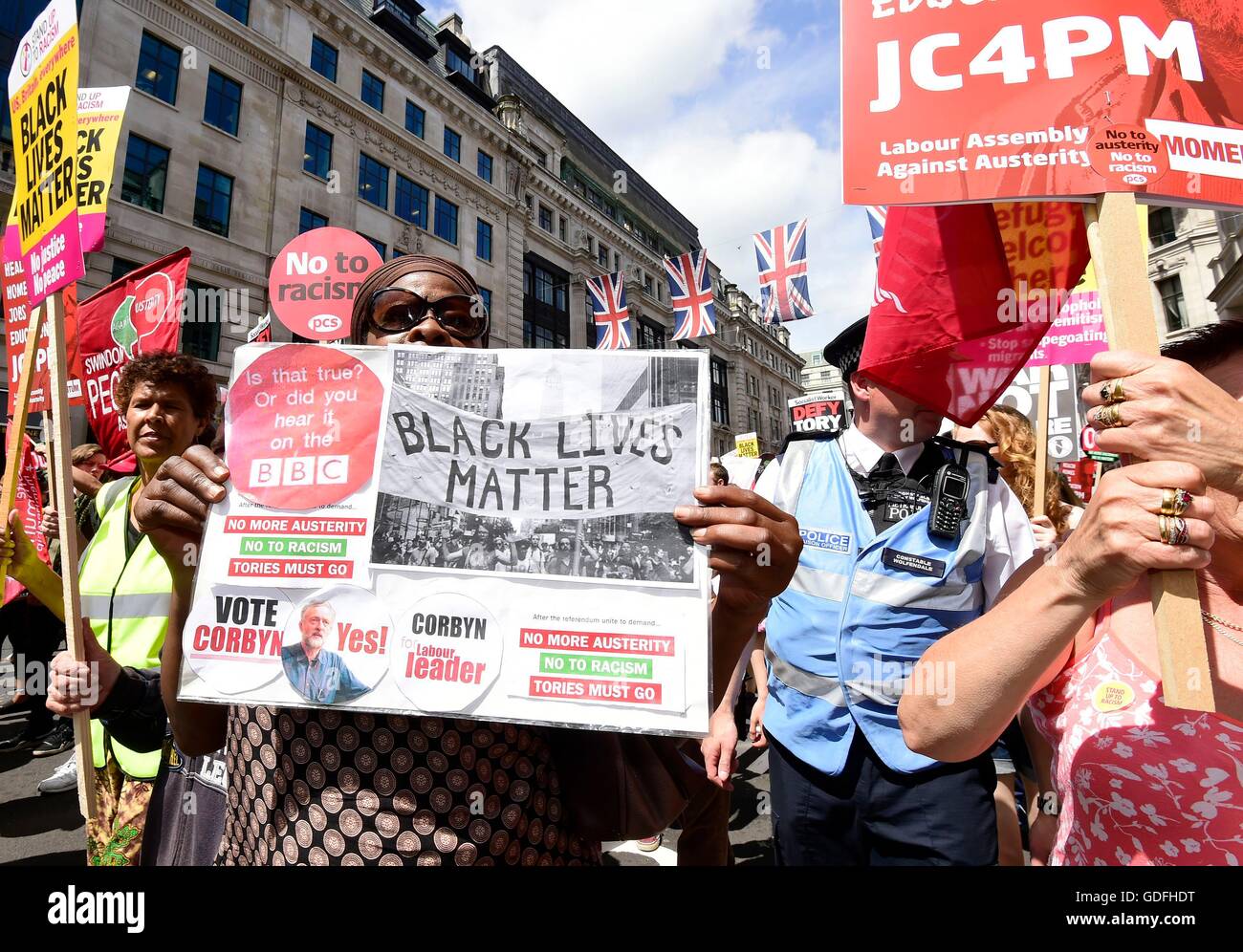 People take part in a 'No More Austerity - No To Racism - Tories Must Go' demonstration organised by the People's Assembly in central London. Stock Photo