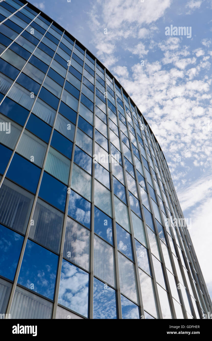 Modern office building against blue sky background Stock Photo - Alamy