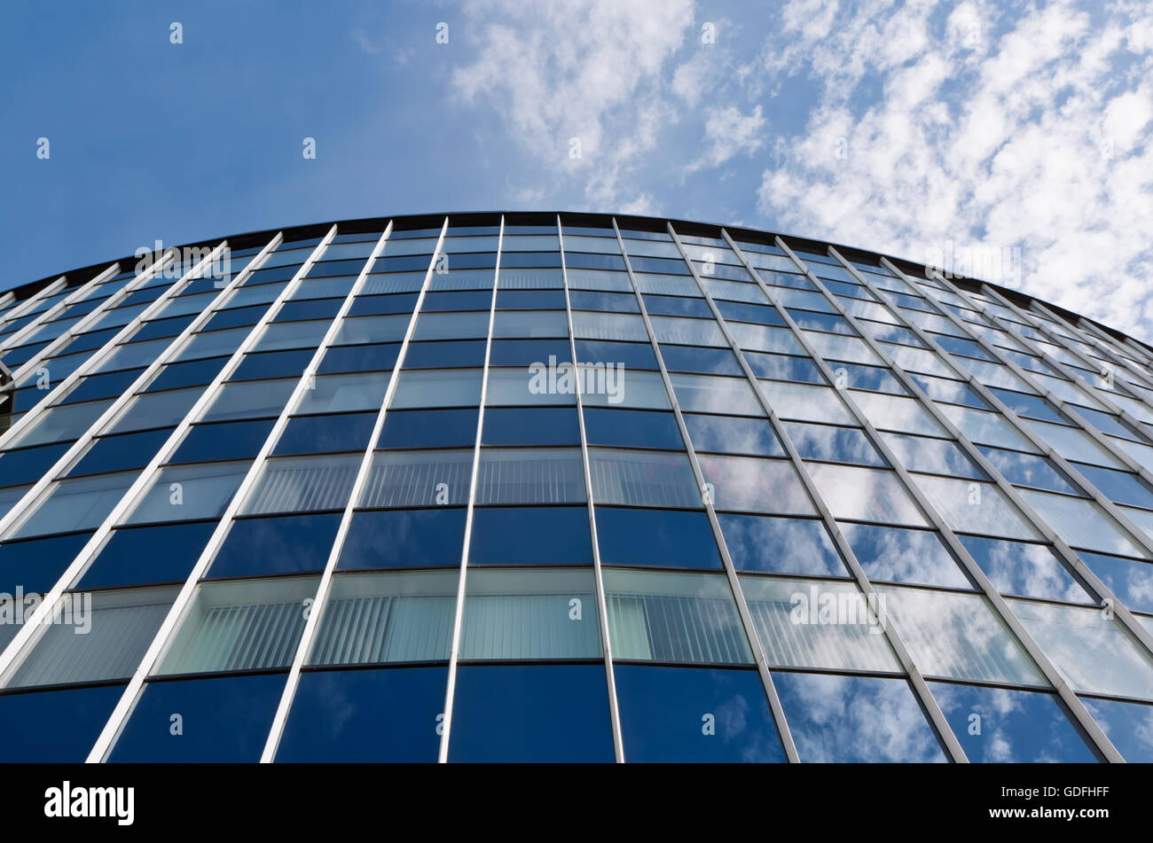Modern office building against blue sky background Stock Photo - Alamy