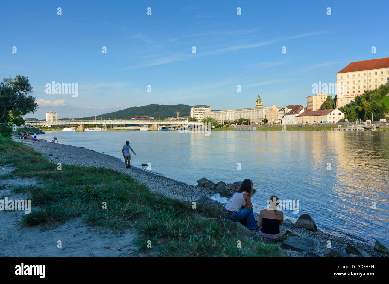 Linz: Castle and Nibelungenbrücke with bathers in the Danube, Austria ...