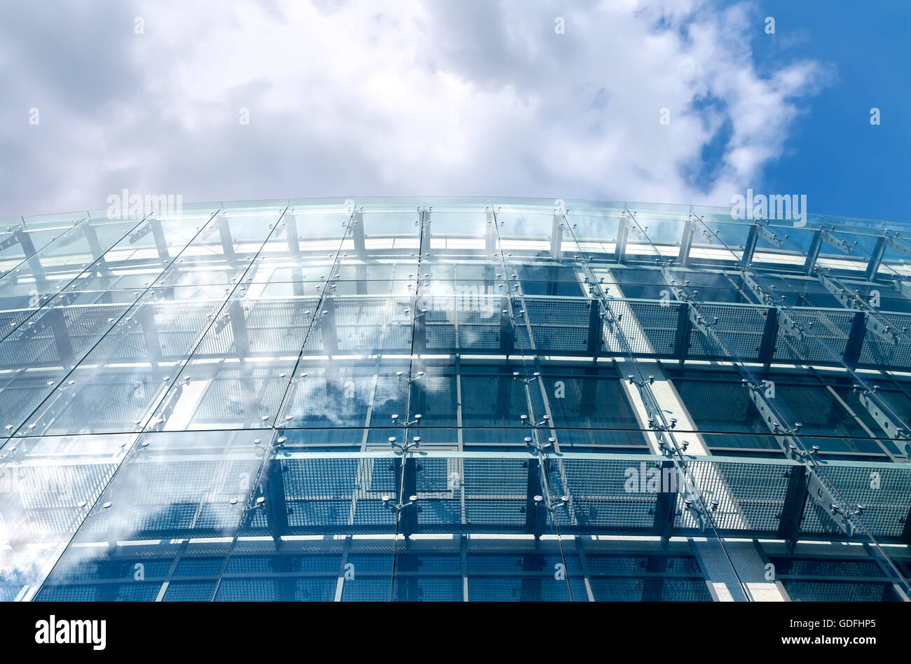 Sky reflecting in the glass of an office building Stock Photo - Alamy