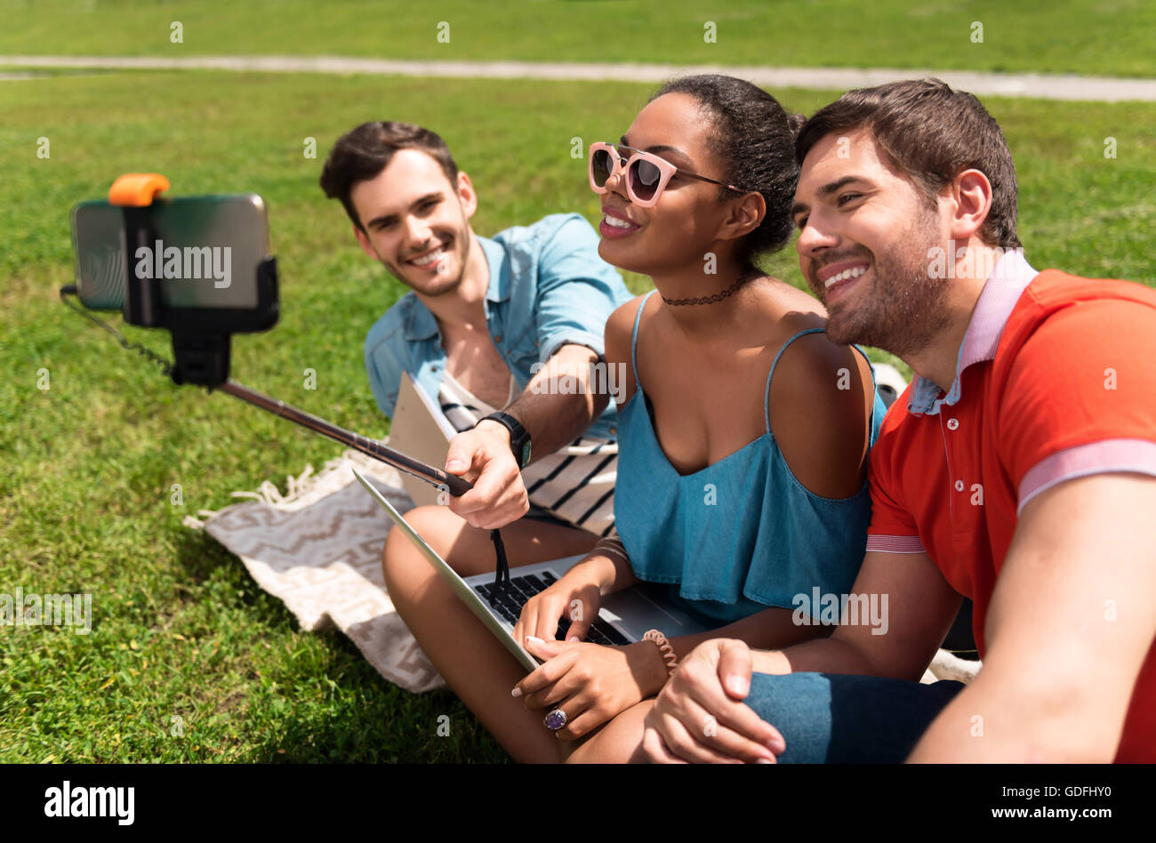 Modern youth relaxing outdoors Stock Photo Alamy
