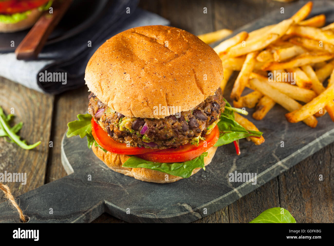 Vegan Homemade Portabello Mushroom Black Bean Burger with Fries Stock