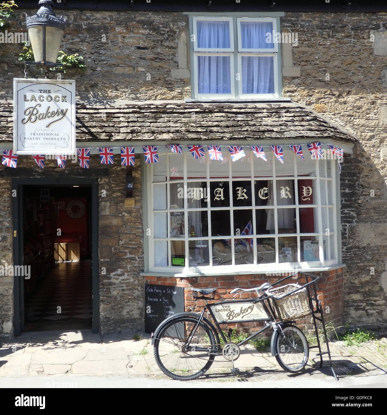 Lacock Bakery with bicycle, Wiltshire in England Stock Photo