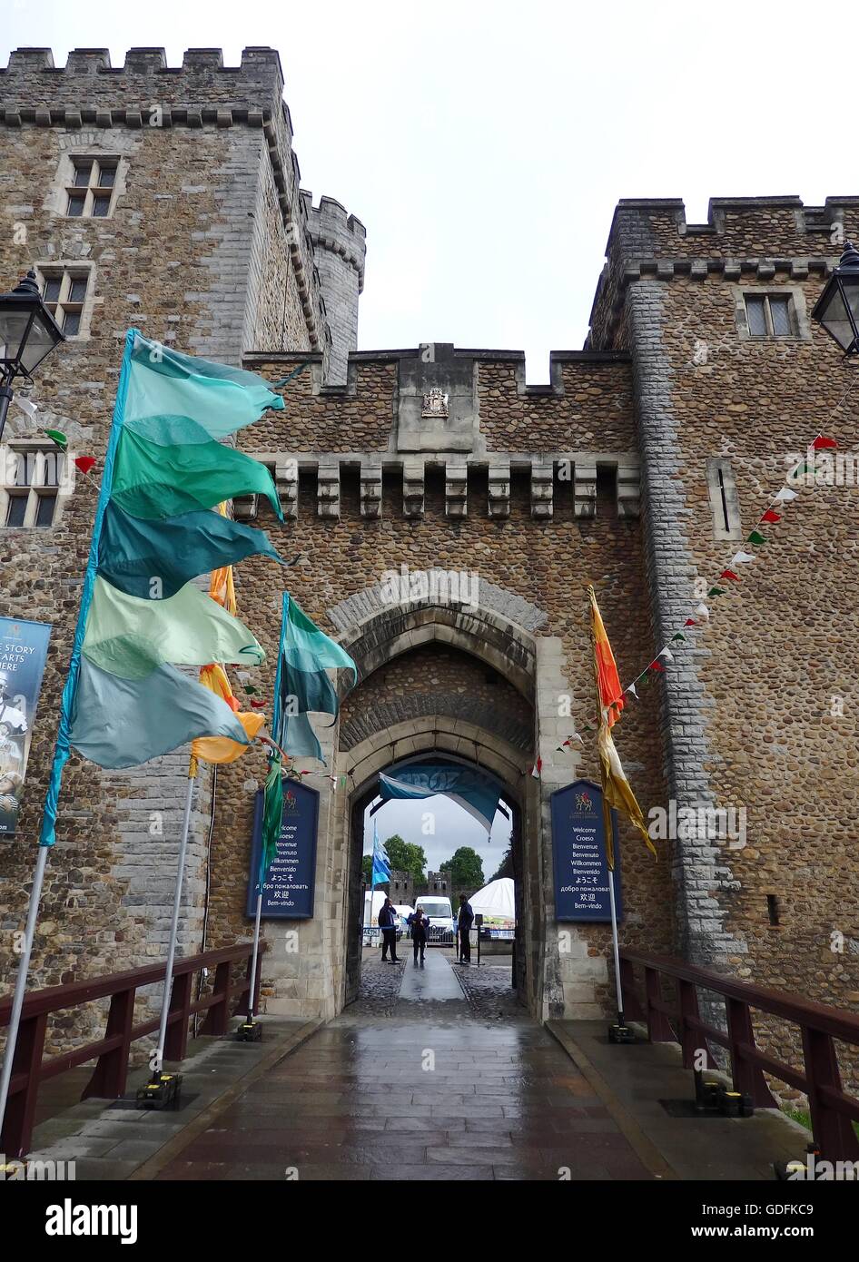 the beautiful exterior of cardiff castle in wales with flags