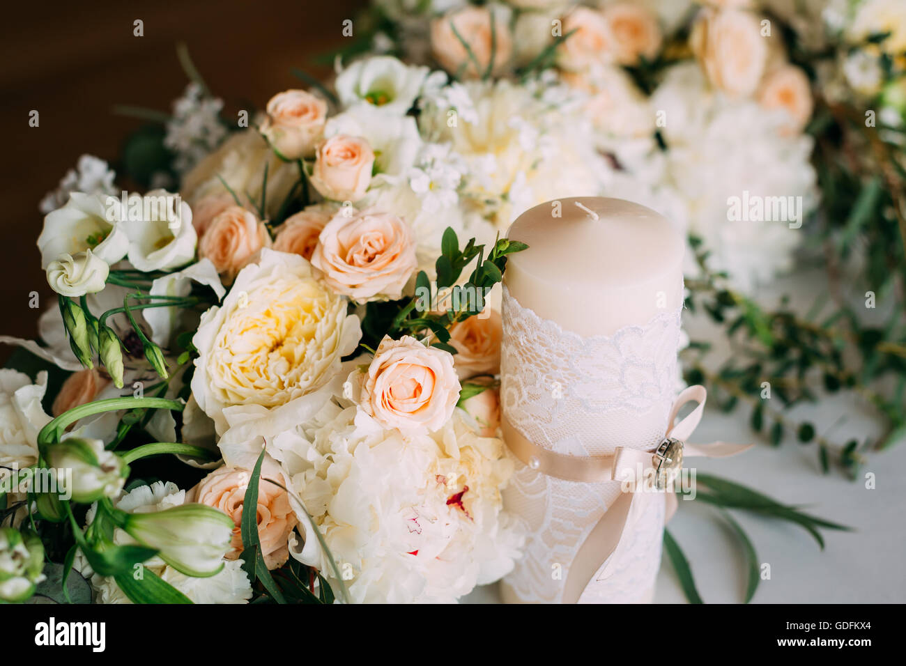 Wedding Candles And Beautiful Flowers Of Roses. Decoration For Wedding