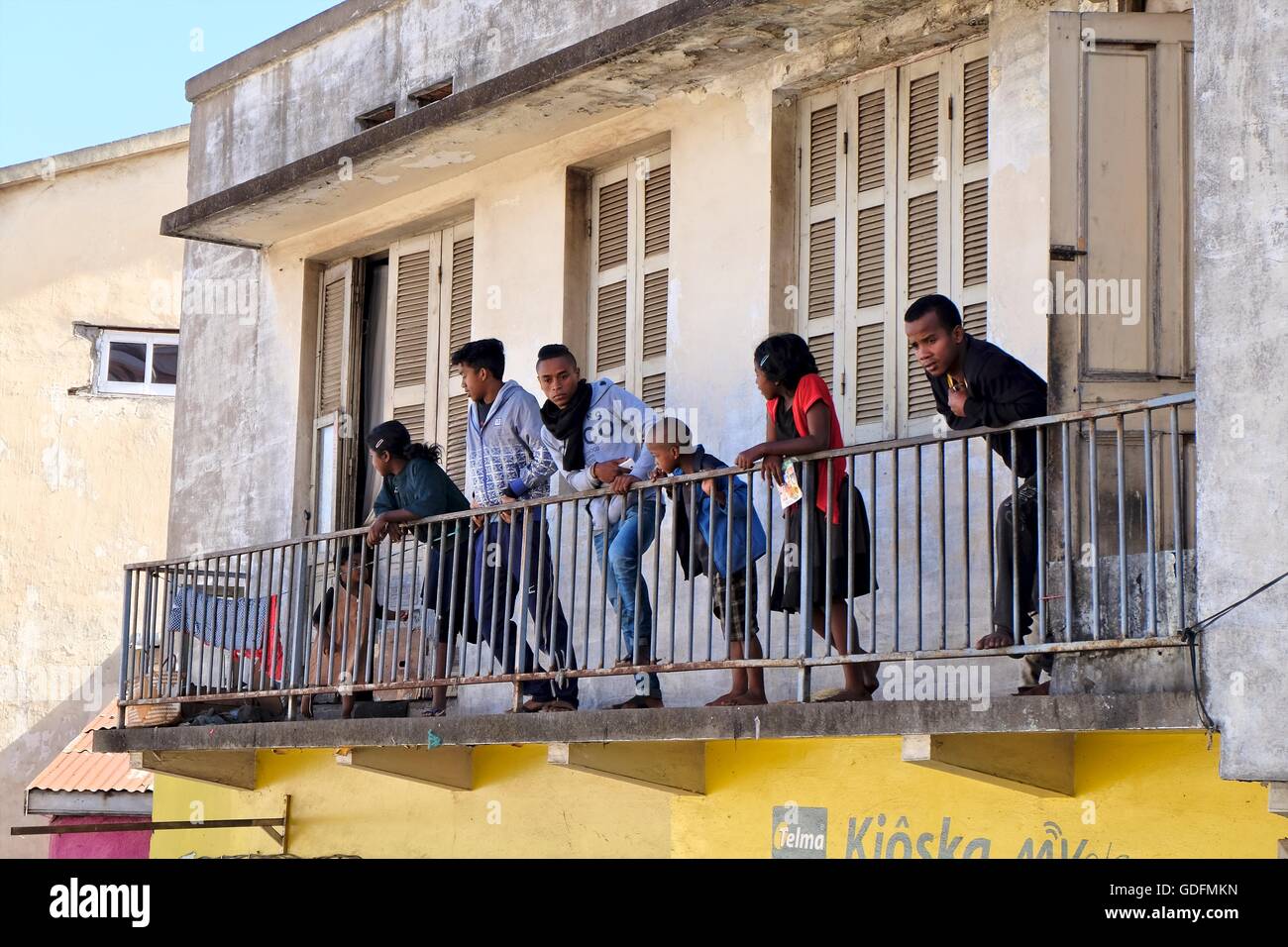Malagasy spectators watching dare-devil riders from balcony in Antananarivo, Madagascar Stock Photo