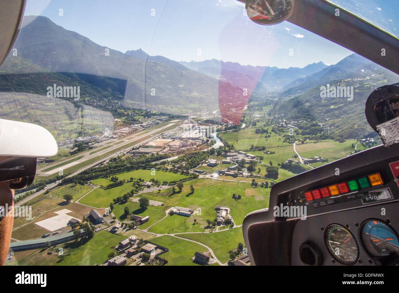 Light aircraft flight in the Aosta Valley, Italy. Coming in to land at Aosta town airport. Stock Photo