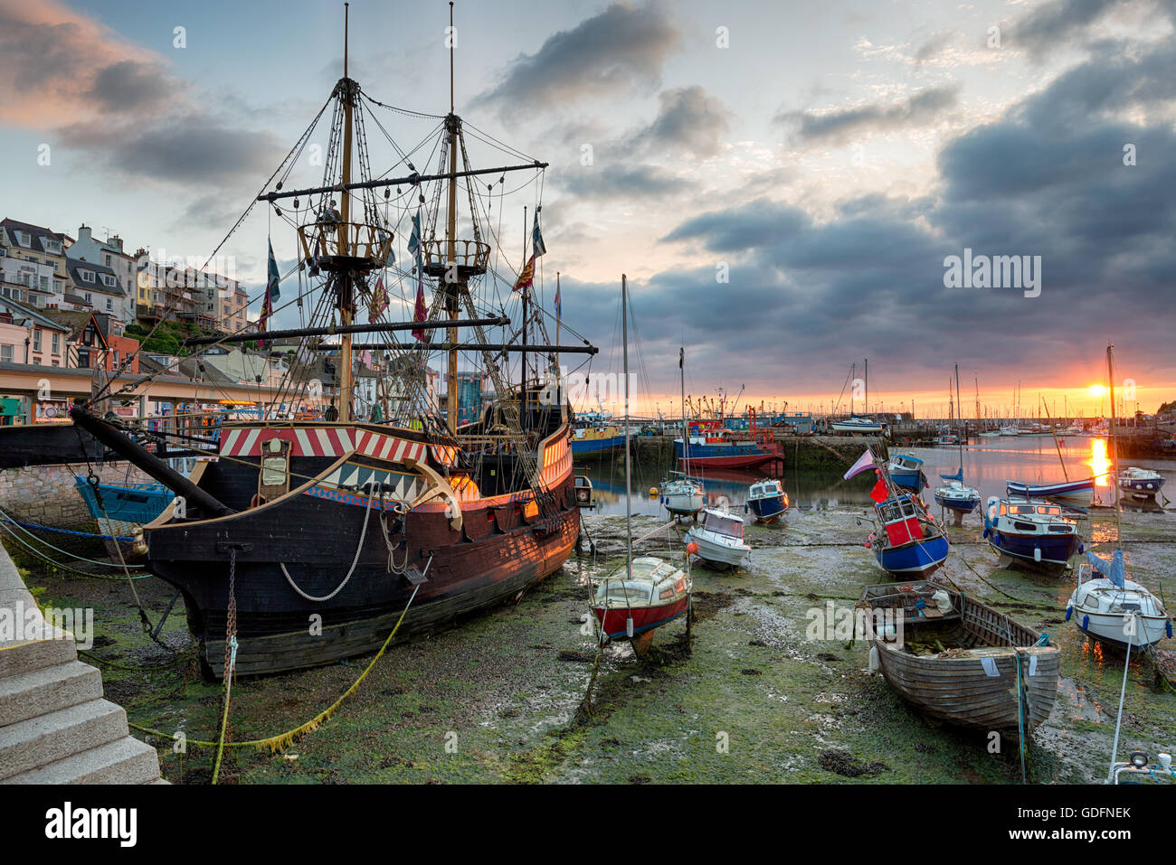 Stunning sunrise over a galleon in Brixham harbour on the south coast of Devon Stock Photo