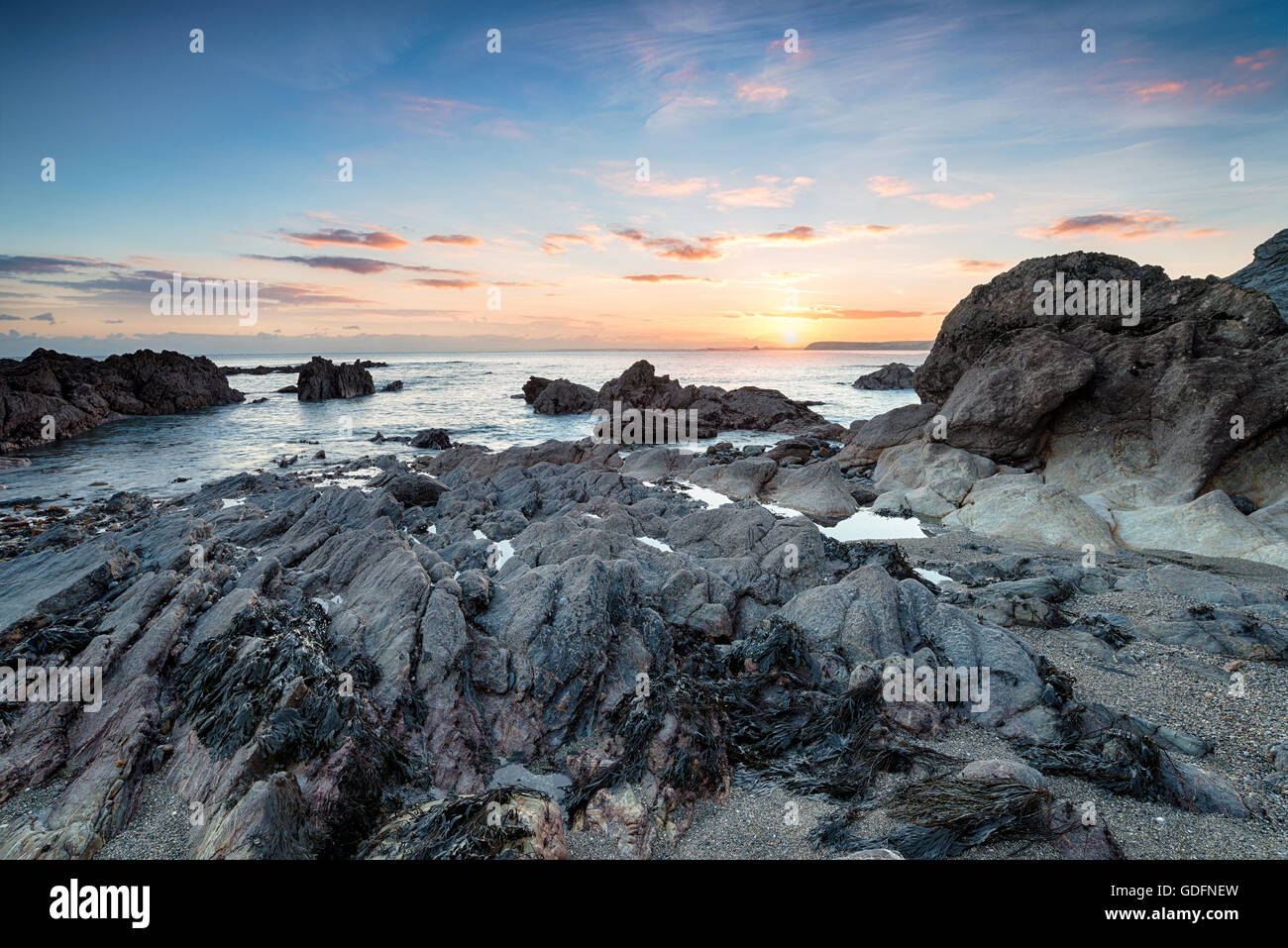 The rocky shore at Hemmickbeach on the south Cornwall coast Stock Photo
