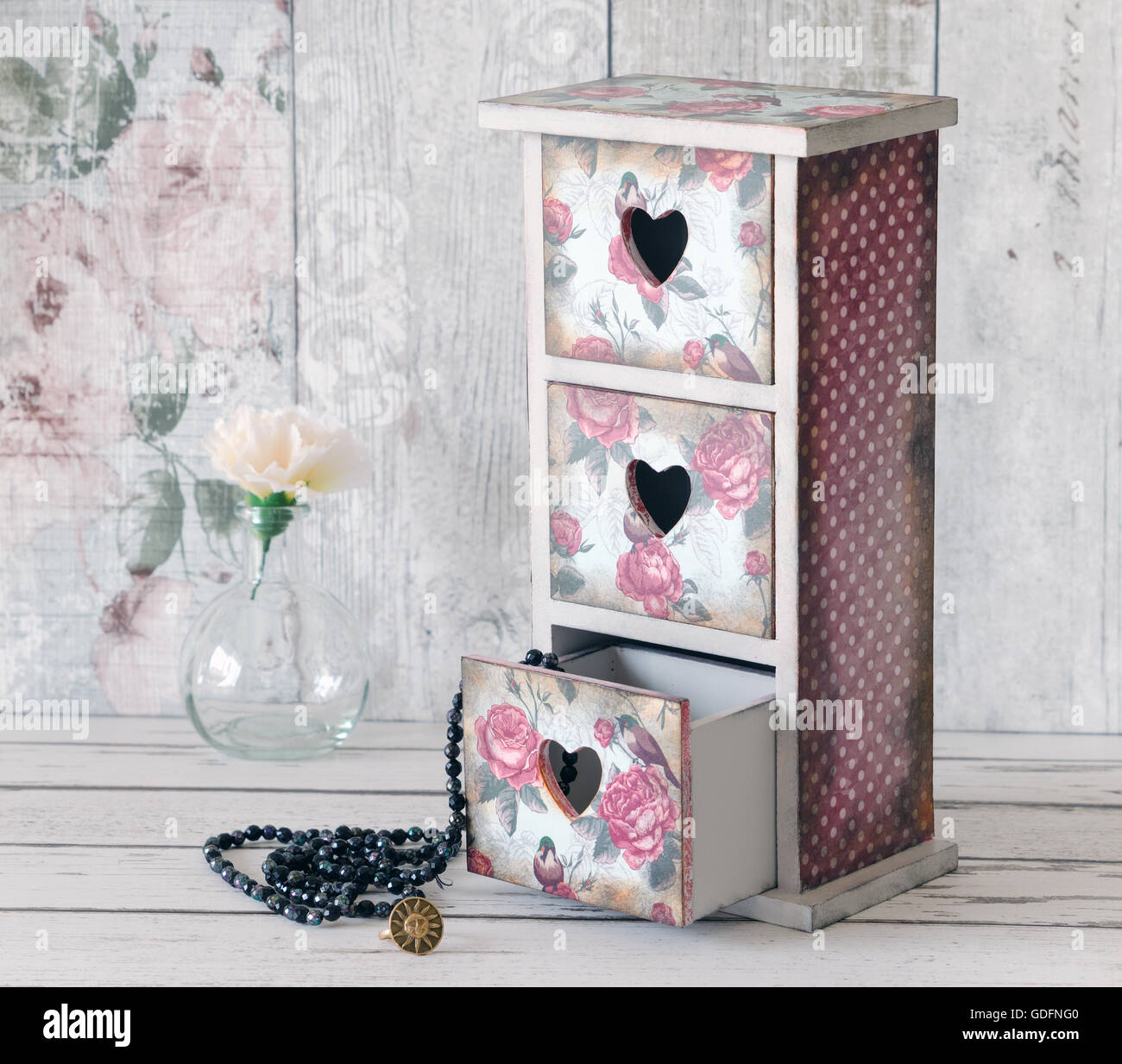 A shabby chic mini chest of drawers decoupaged in a vintage floral pattern Stock Photo