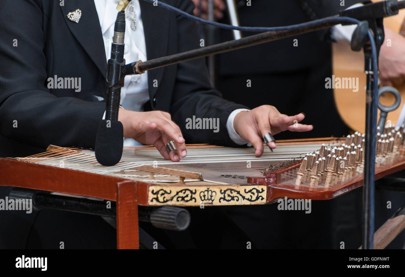 Hands and Arabian Qanon Musical Instrument Stock Photo