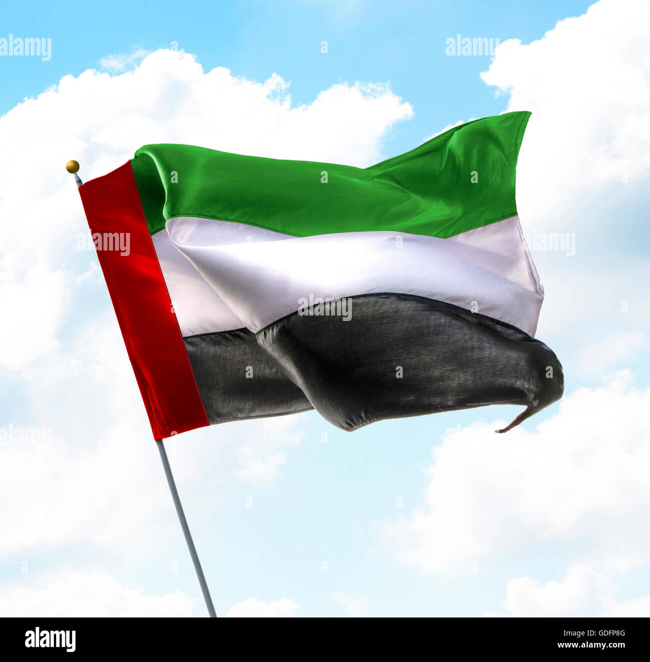 Flag of United Arab Emirates Raised Up in The Sky Stock Photo