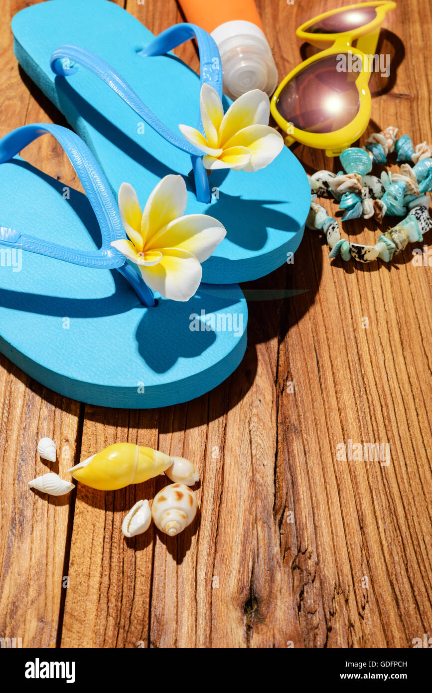 blue flip-flops and sunglasses on the wooden board Stock Photo - Alamy
