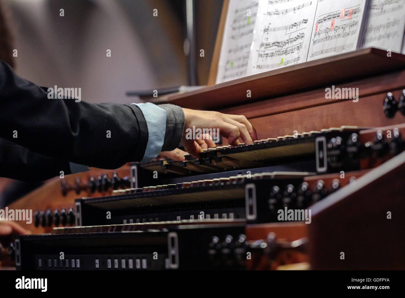 Close up view of a organist playing a pipe organ with motion blur Stock