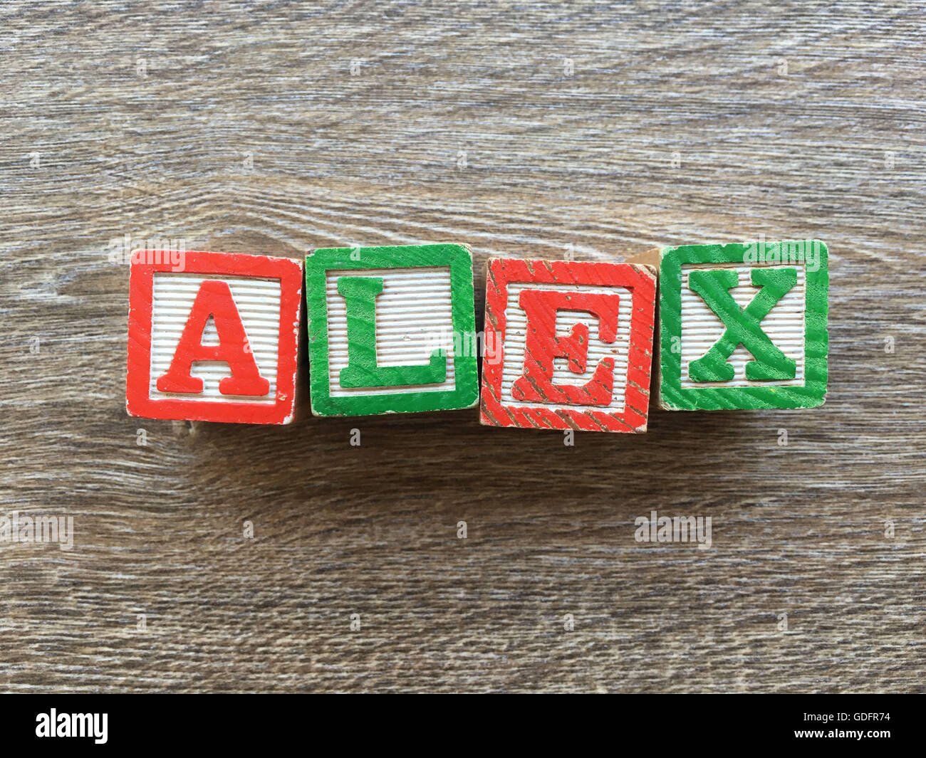 Alex name written with wood block letter toys Stock Photo - Alamy
