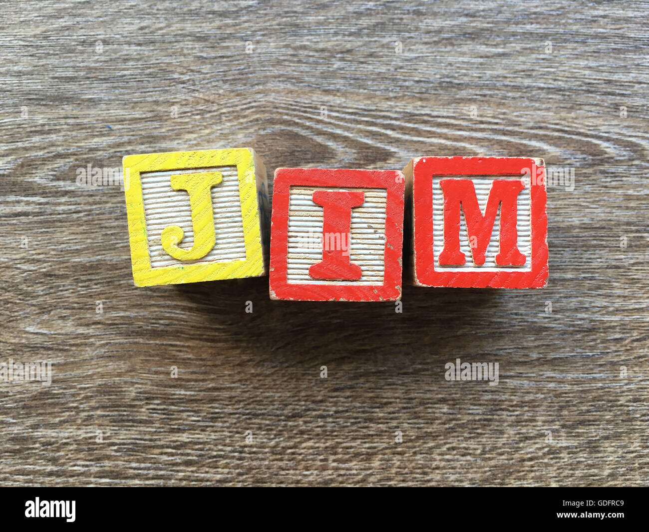 Jim name written with wood block letter toys Stock Photo Alamy