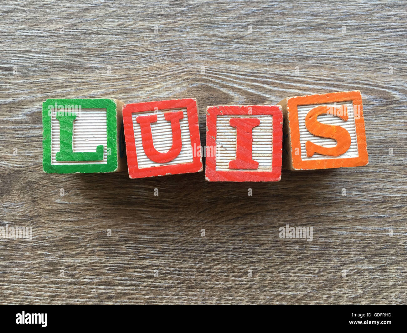 Luis name written with wood block letter toys Stock Photo - Alamy