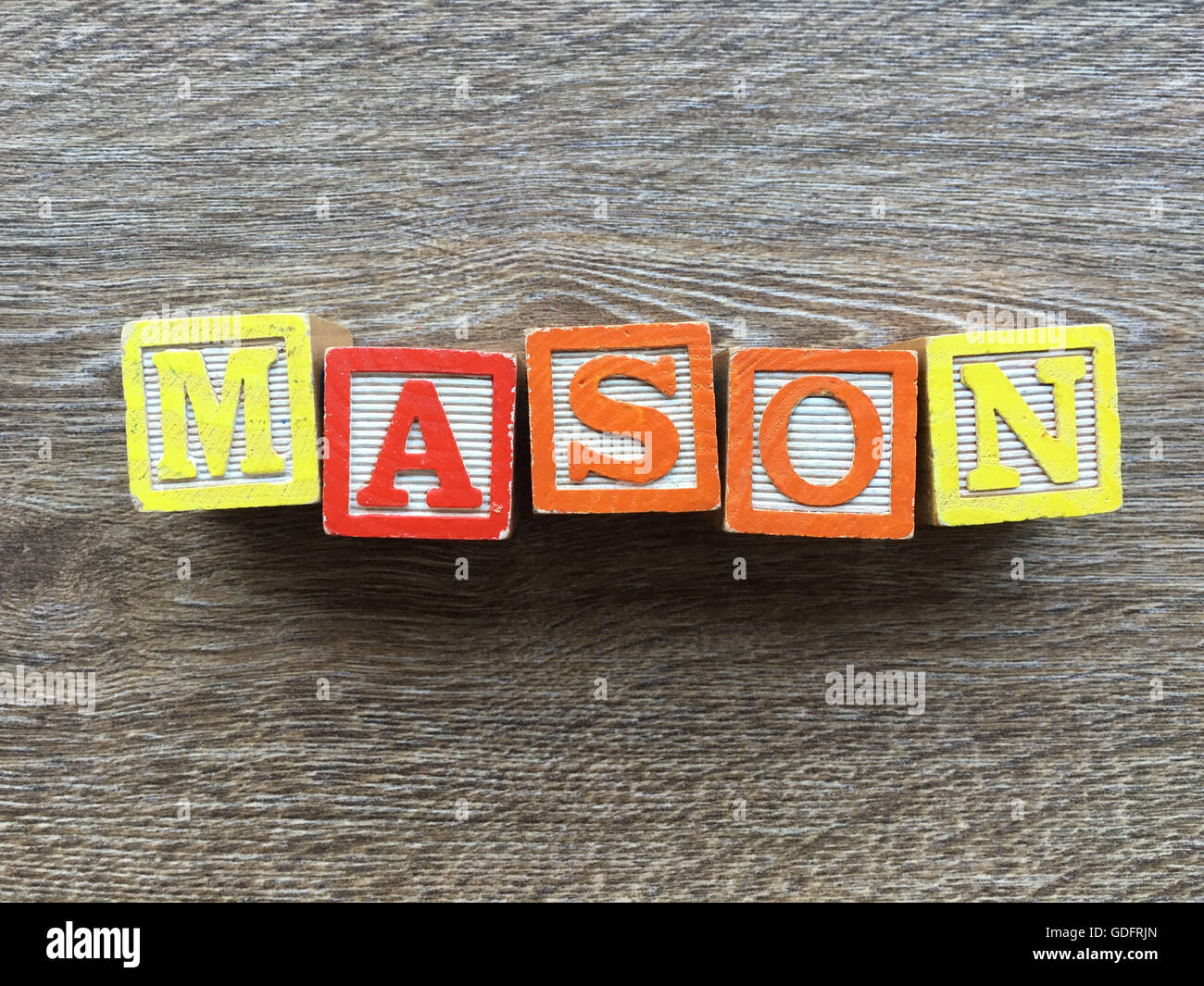 Mason name written with wood block letter toys Stock Photo Alamy