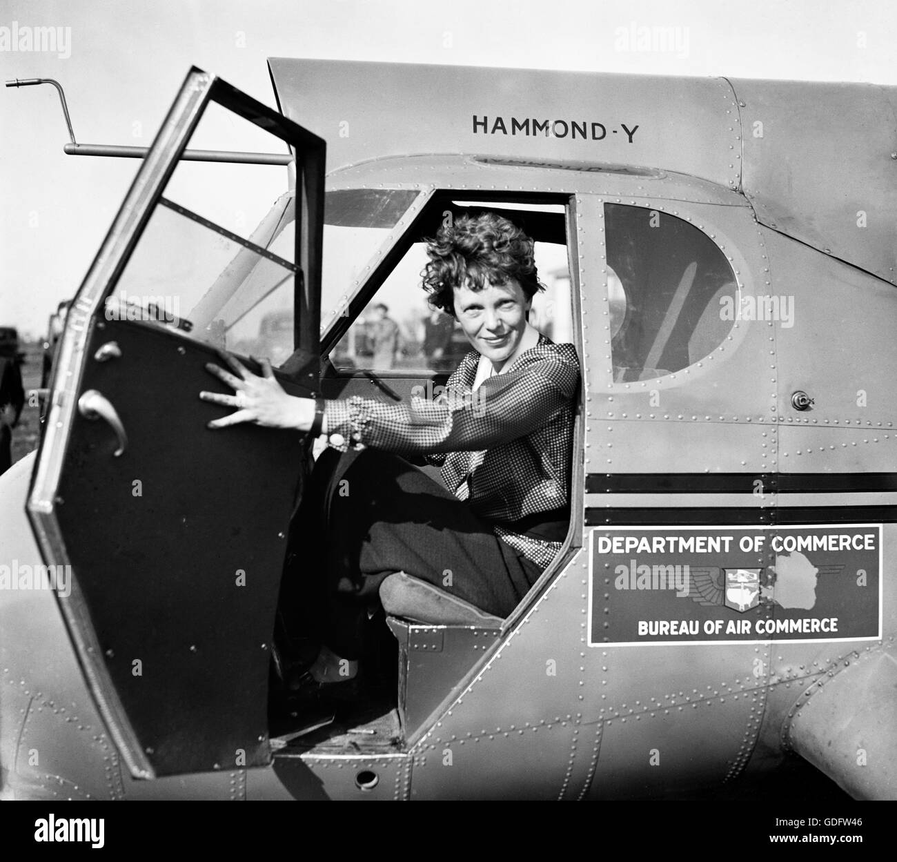 Amelia Earhart (1897-1937) in the cockpit of an airplane c.1936. Photo by Harris and Ewing. Stock Photo