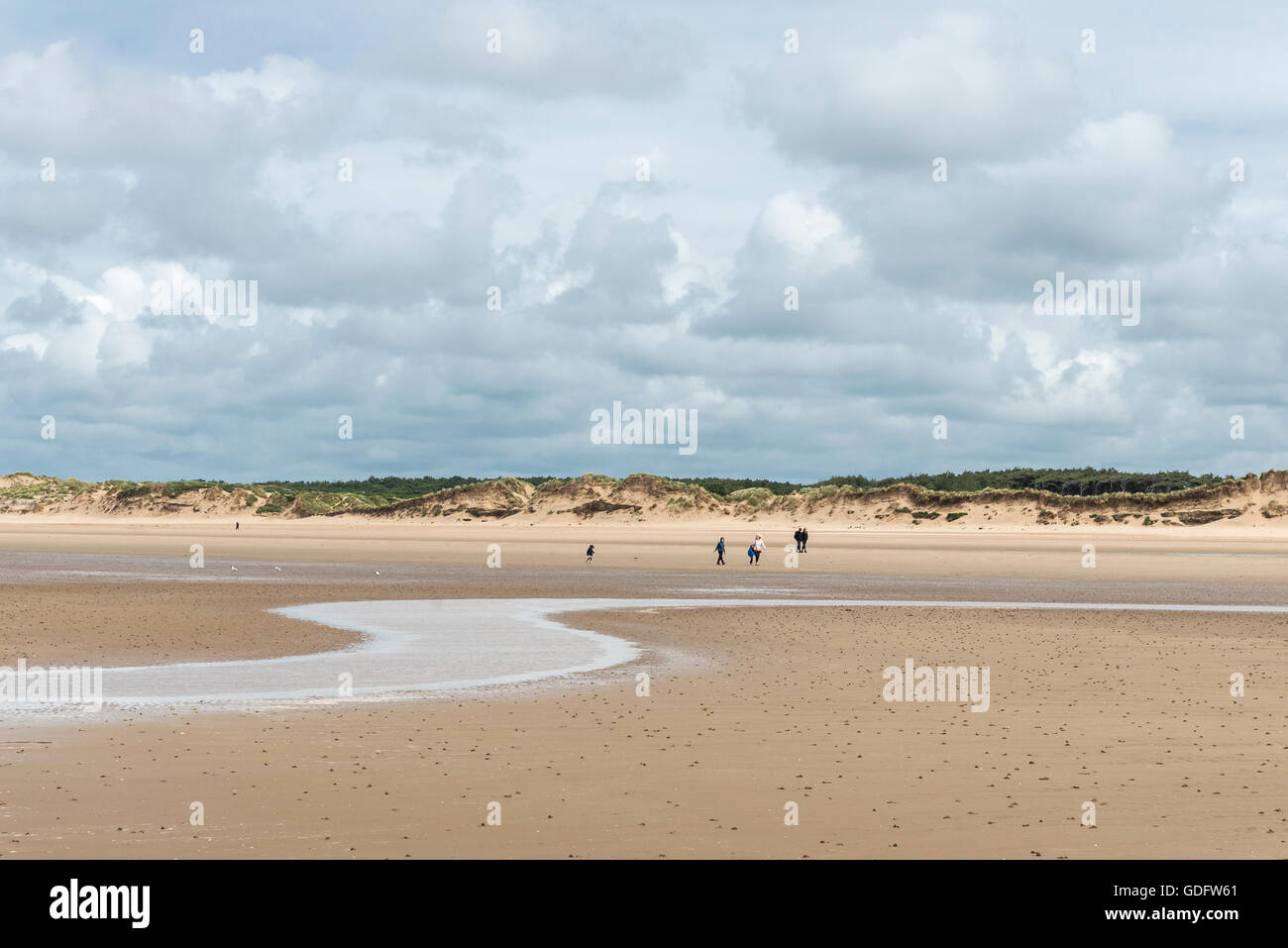 Figures on the beach at Formby point in Merseyside. Stock Photo