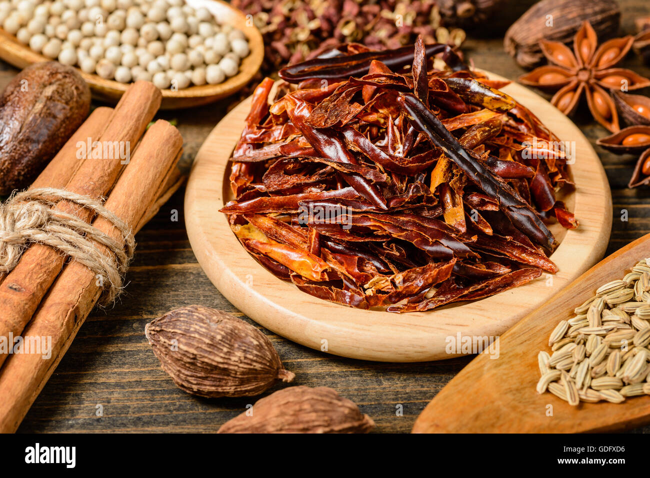 dry chili on the wooden board Stock Photo
