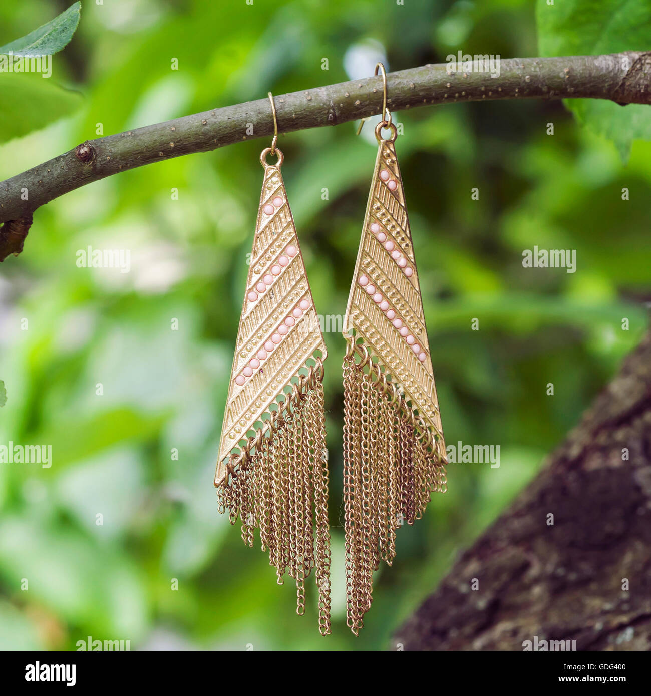 beautiful long golden earrings Stock Photo