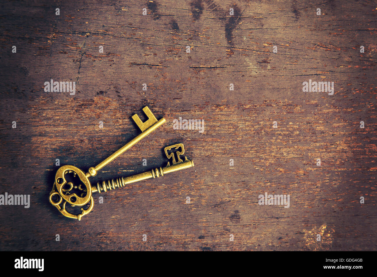old key on wood background with space Stock Photo - Alamy