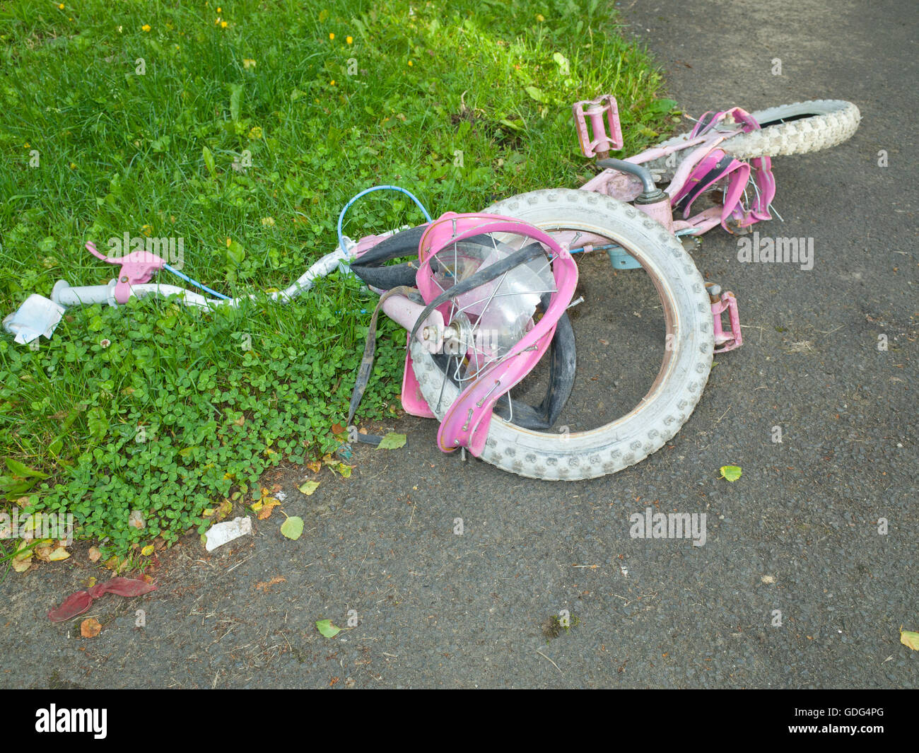 Discarded kids bike UK Stock Photo