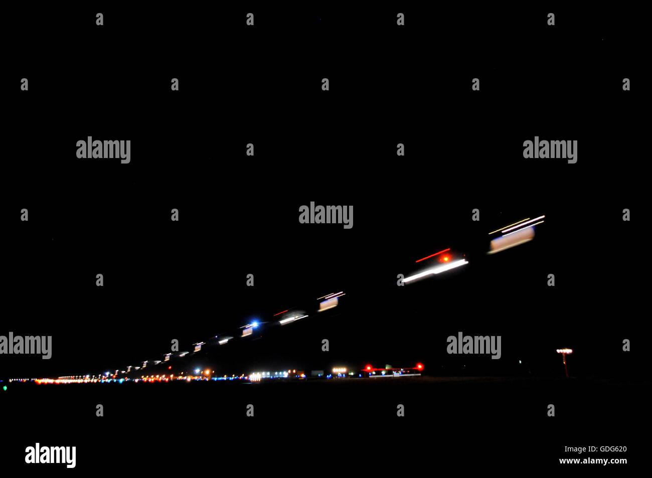 Layered exposures of an airplane landing Stock Photo