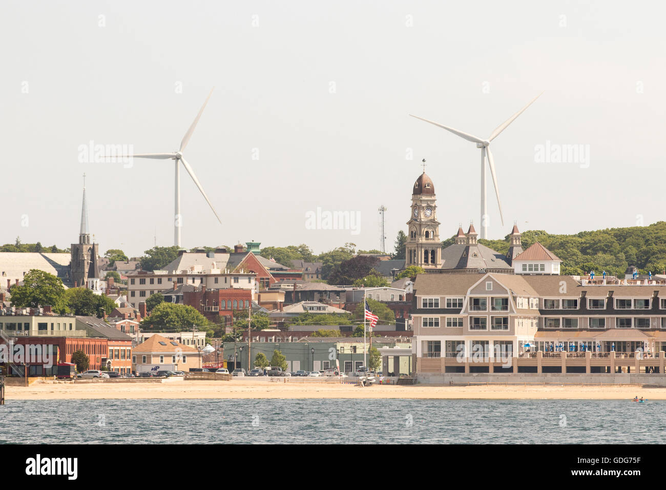 Gloucester Massachusetts view from water. Wind turbines, wind farm, in Stock Photo