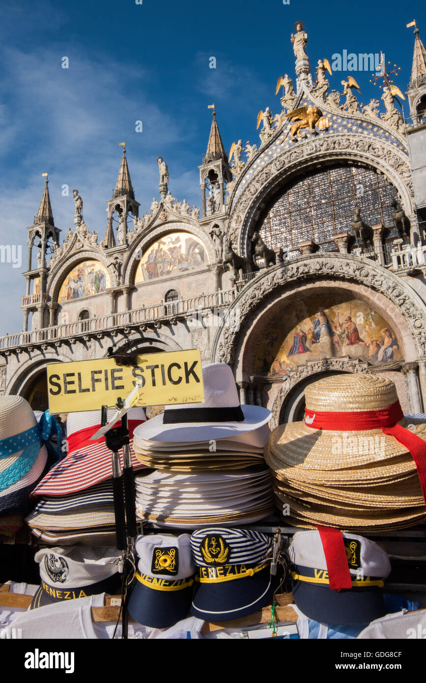 Souvenirs on sale in front of the Basilica di San Marco, Venice, Italy Stock Photo