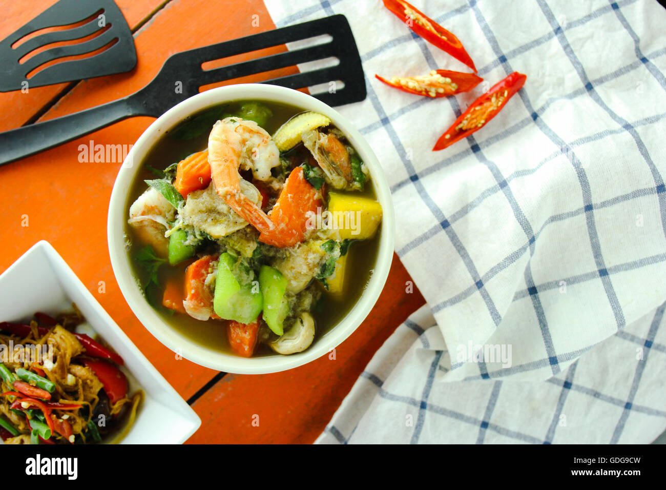 thai curry and garnish on the table. thai food. Stock Photo