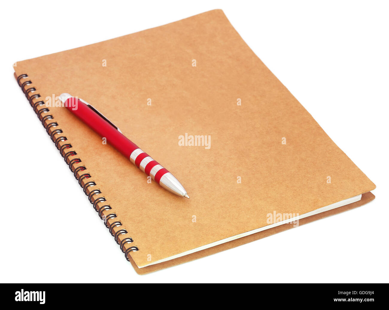 Spiral bound organizer with ballpoint on it over white background Stock Photo