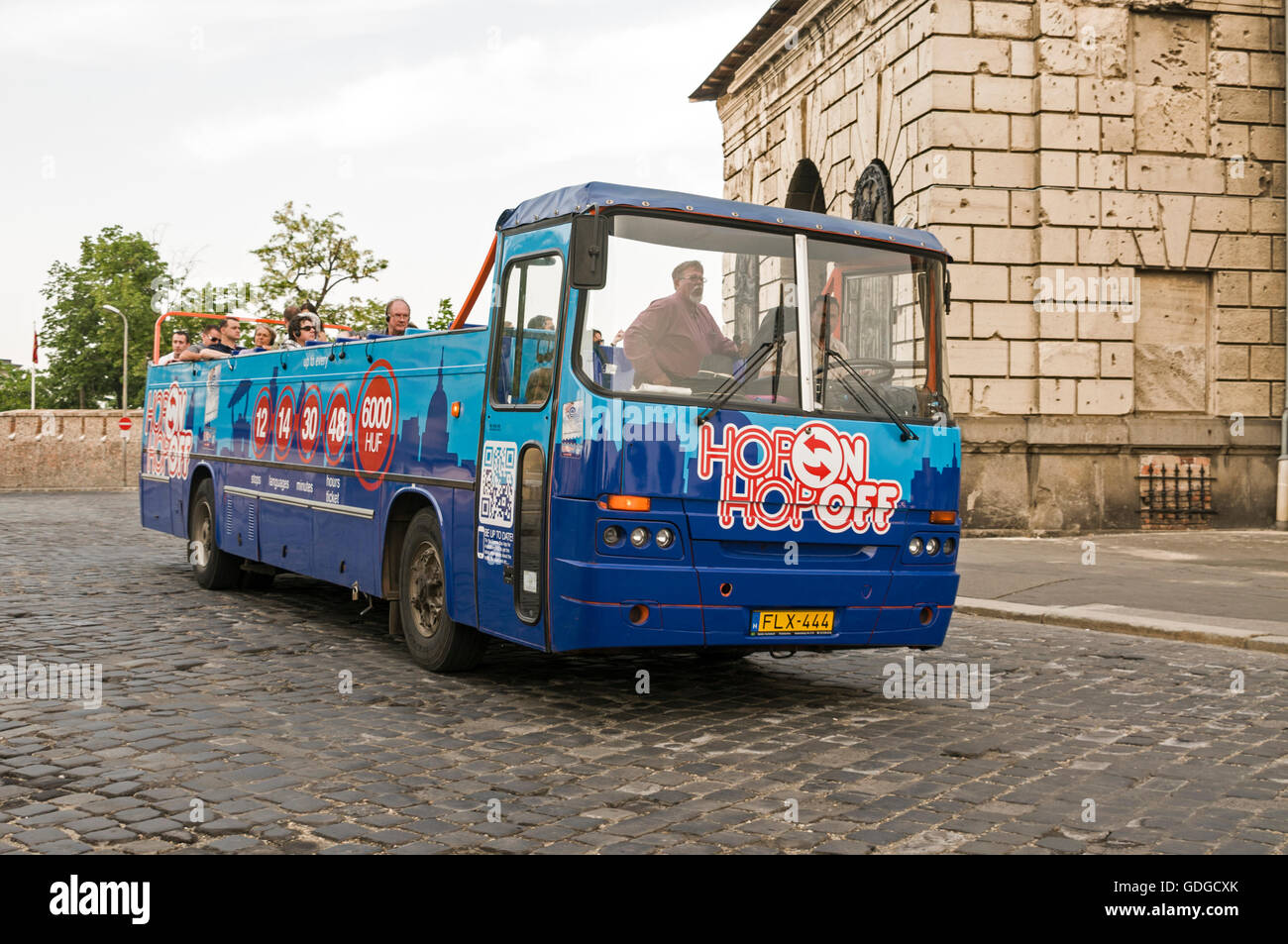 A tourist Hop-on-Hop-off bus on Buda Castle Hill in Budapest, Hungary. Stock Photo
