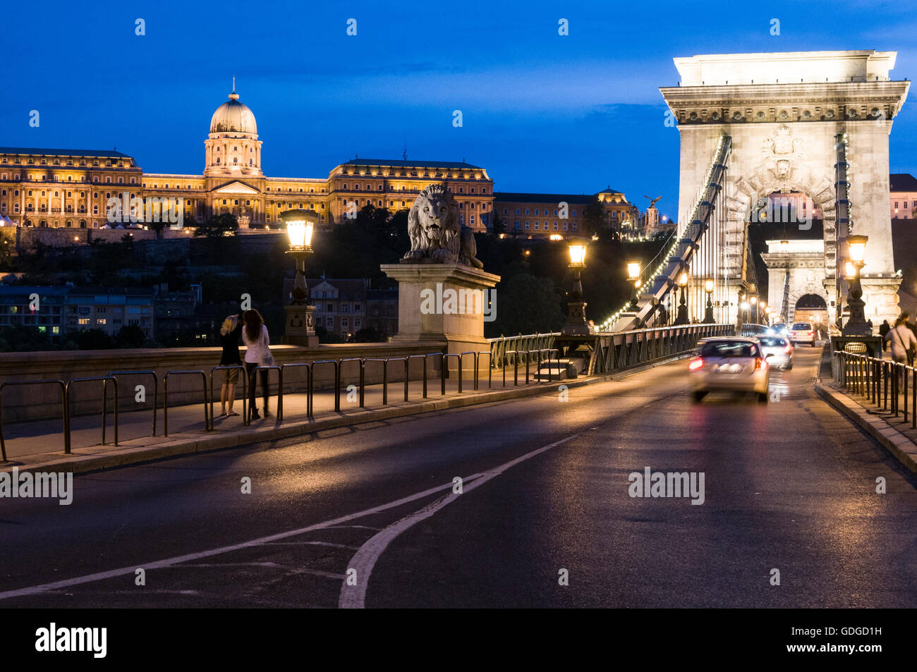 The former Royal Palace and the oldest bridge, Széchenyi Chain Bridge in Budapest in Hungary.  The Chain Bridge was designed by Stock Photo